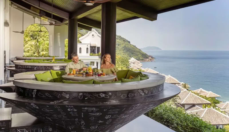 Romantic rooftop dinner overlooking city skyline by Tonkin Legends