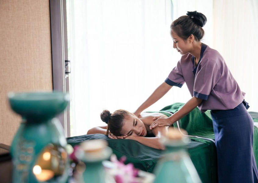 Relaxing back massage treatment by a skilled therapist at Banyan Tree Lang Co spa