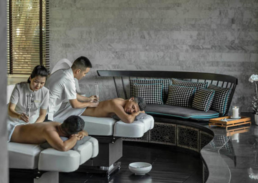 Customers receiving simultaneous back massage treatments in the luxury spa suite at InterContinental Danang Sun Peninsula