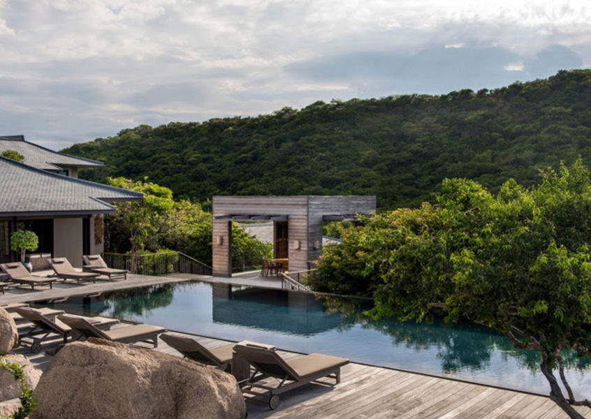 Amanoi resort pool terrace with jungle hillside Ninh Thuan