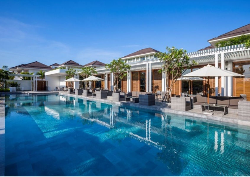 Poolside villas and loungers at Premier Village Danang