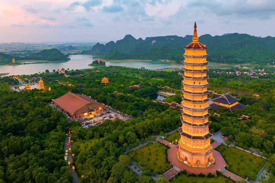 Bai Dinh Pagoda tower illuminated at dusk, Ninh Binh