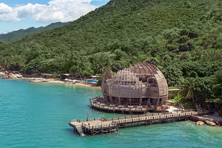 Round wooden restaurant on stilts over the water at an adults-only retreat near Nha Trang