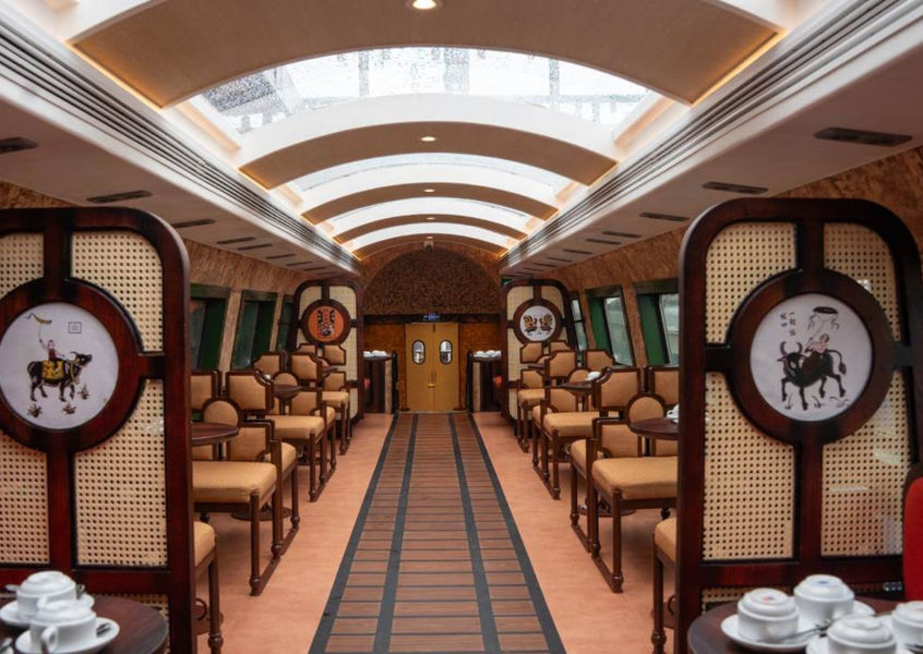 Interior of The Hanoi Train carriage with rattan seating